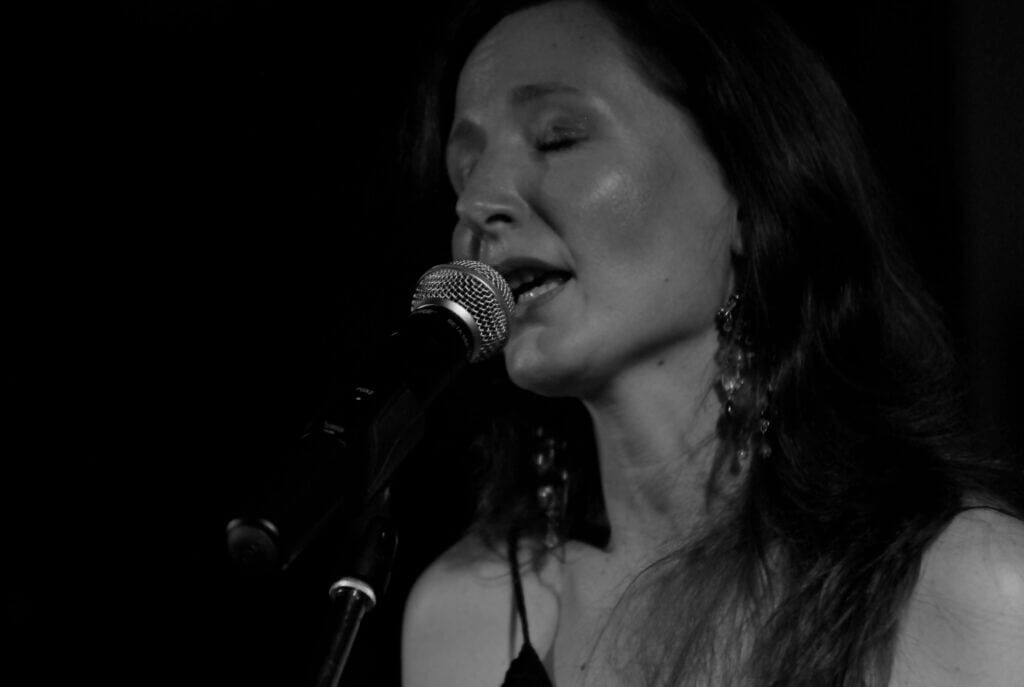 Woman sings with twang